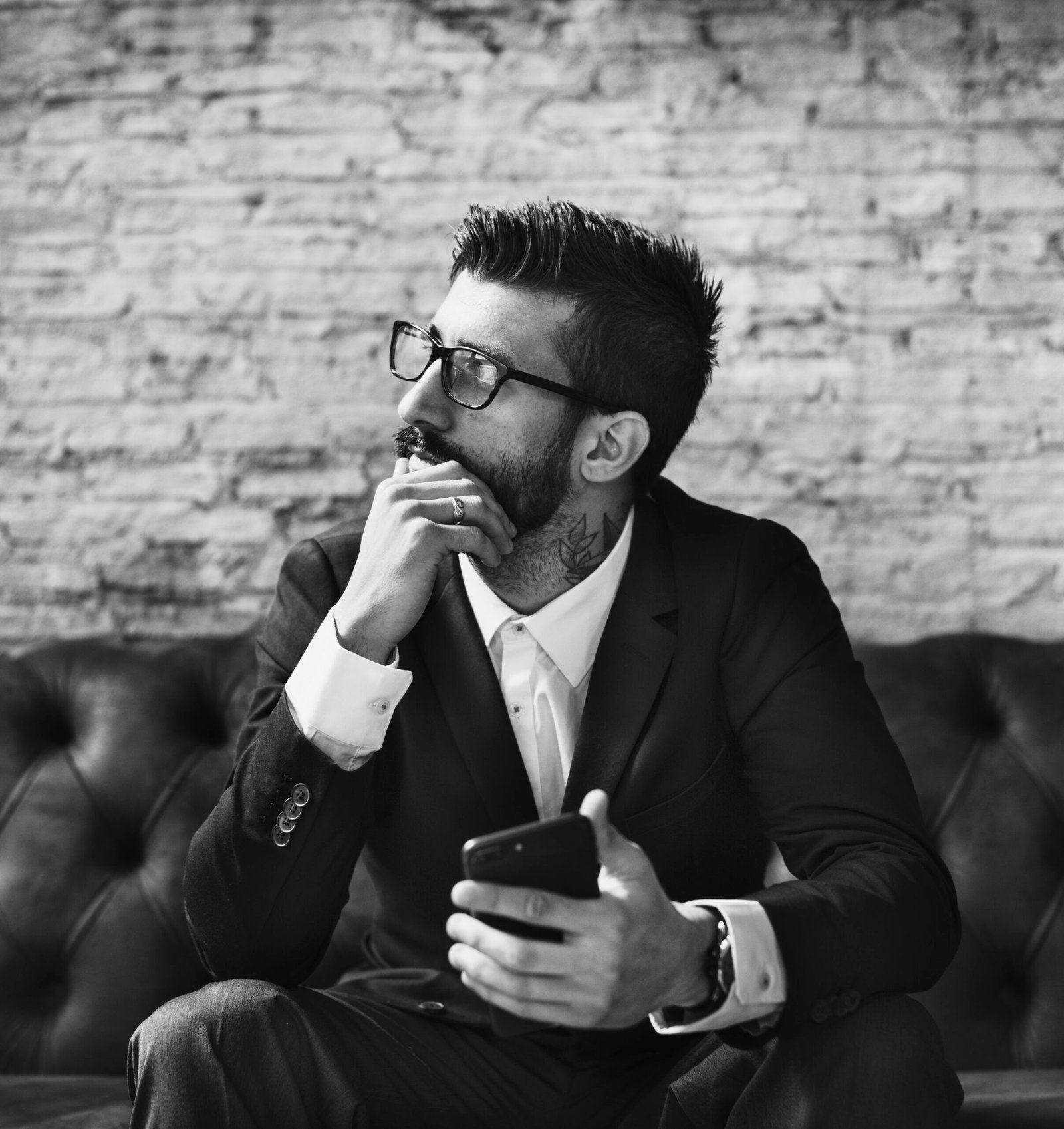 classy man using mobile phone scaled.jpg