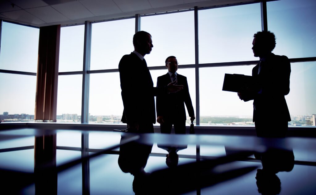 Business talk dark silhouettes