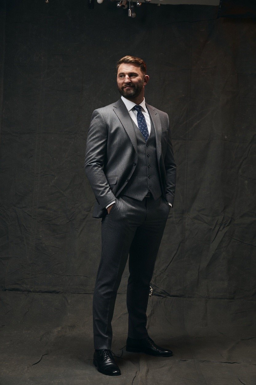 Paul wood full body dark suit