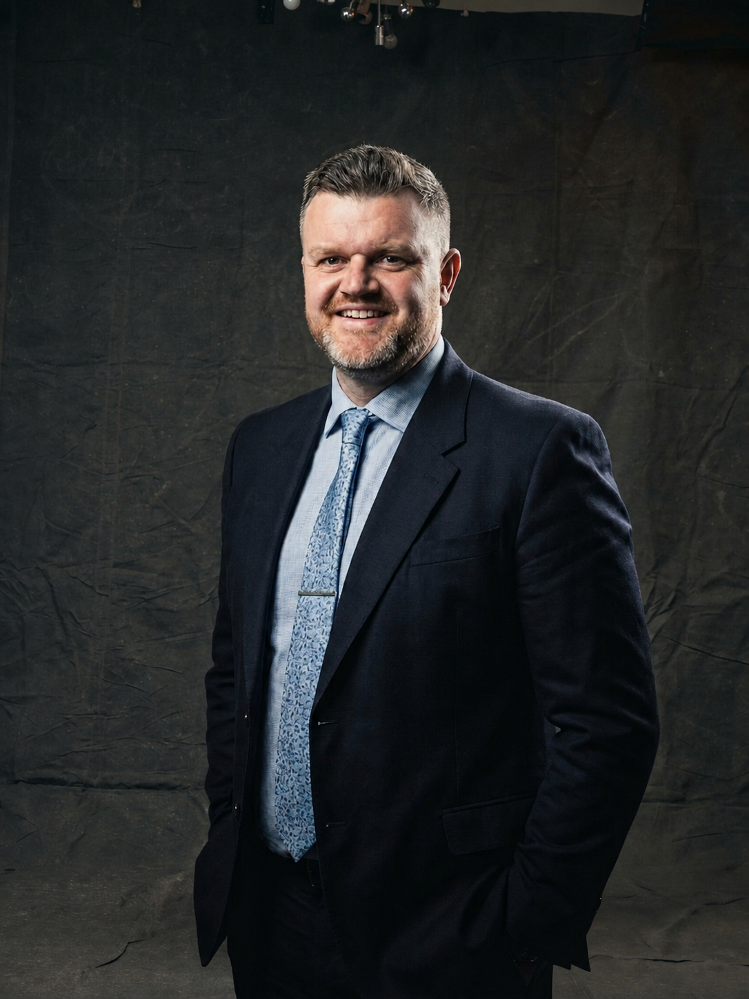 Krystian Liptrot - Co-Founder of Forge Leadership and Performance half body professional shot in suit